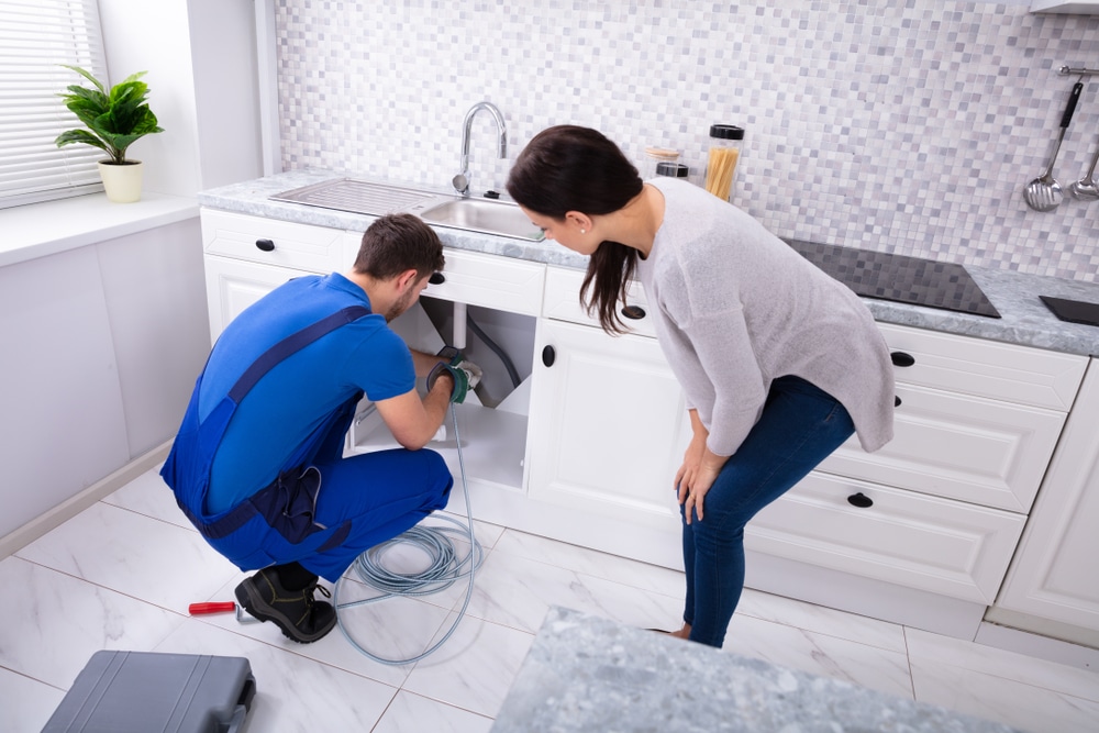 Professional plumber addressing common plumbing issues
