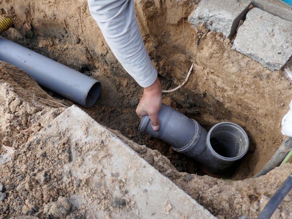 plumber performing sewer line repair service